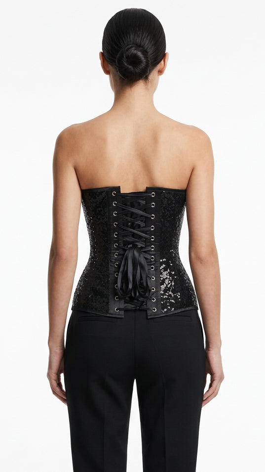 Black sequin corset with front lacing, metal grommets, and wide waist shaping