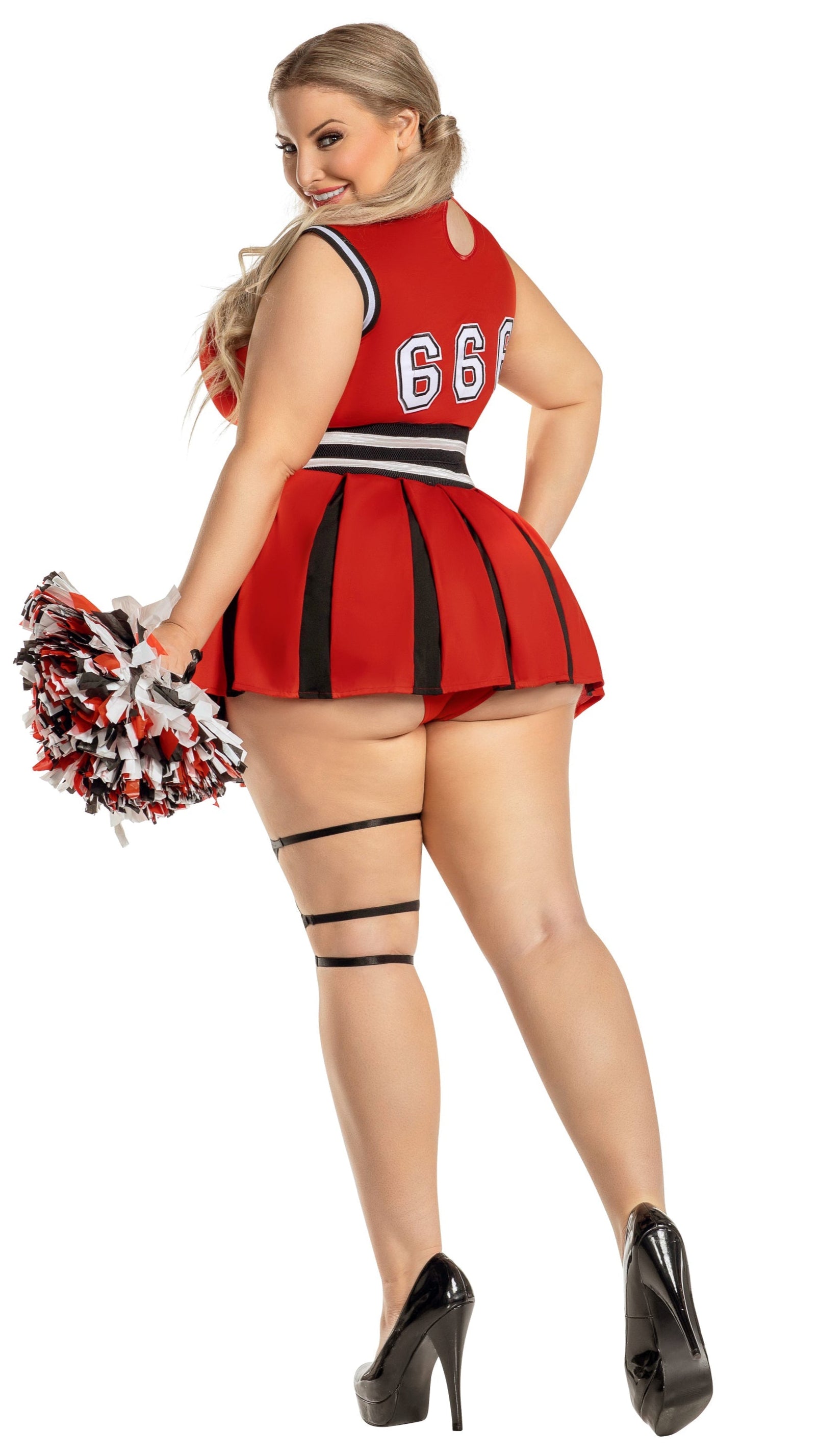 Woman wearing Plus Size Hellbent Cheerleader outfit with strappy pentagram detail, skirted panty with garter, and holding matching pom-poms.
