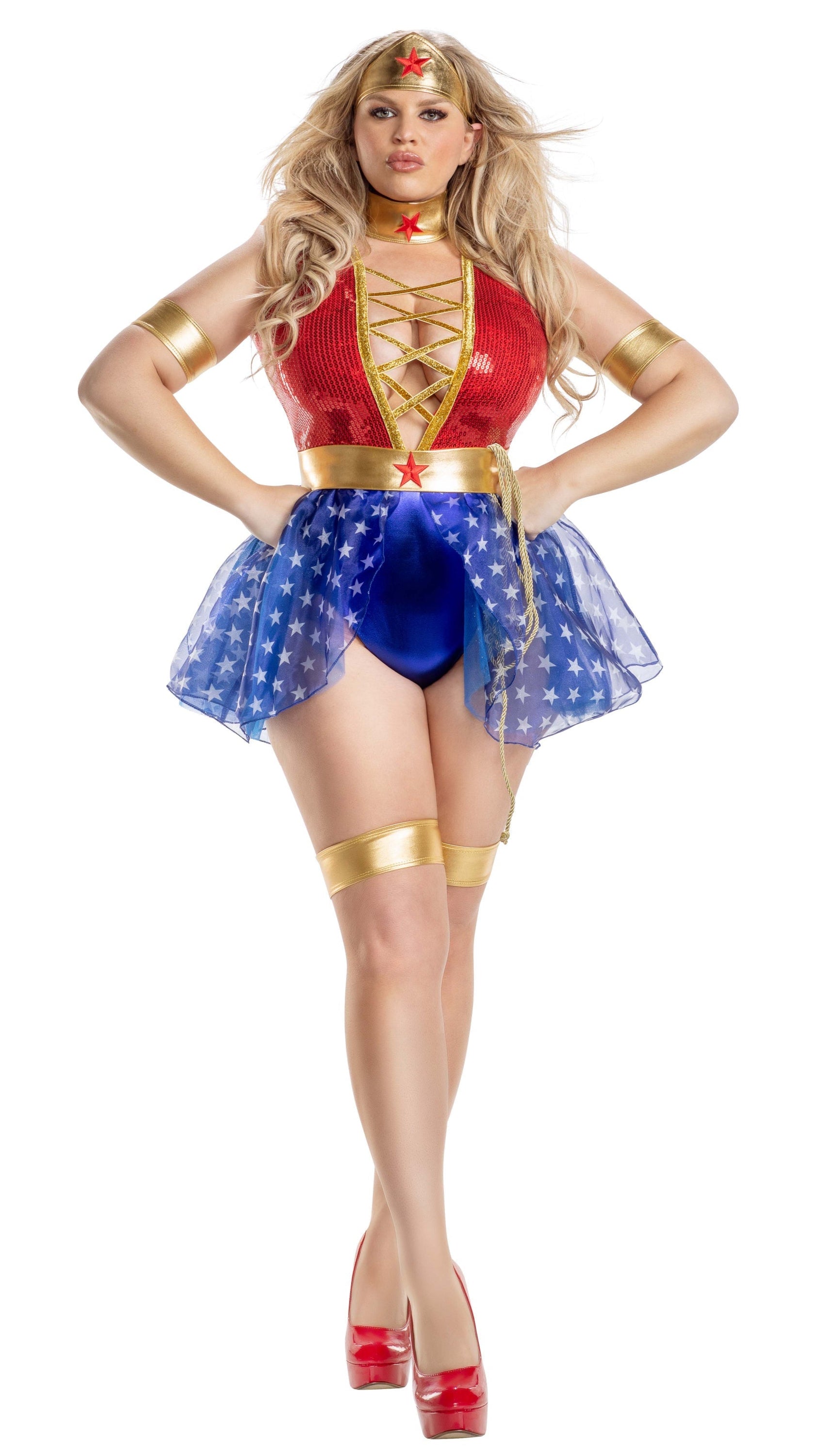 Model wearing Plus Size Wonderlady peplum teddy with sequin and lamé accents, featuring matching garters, arm bands, lasso, belt, neckpiece, and headpiece.