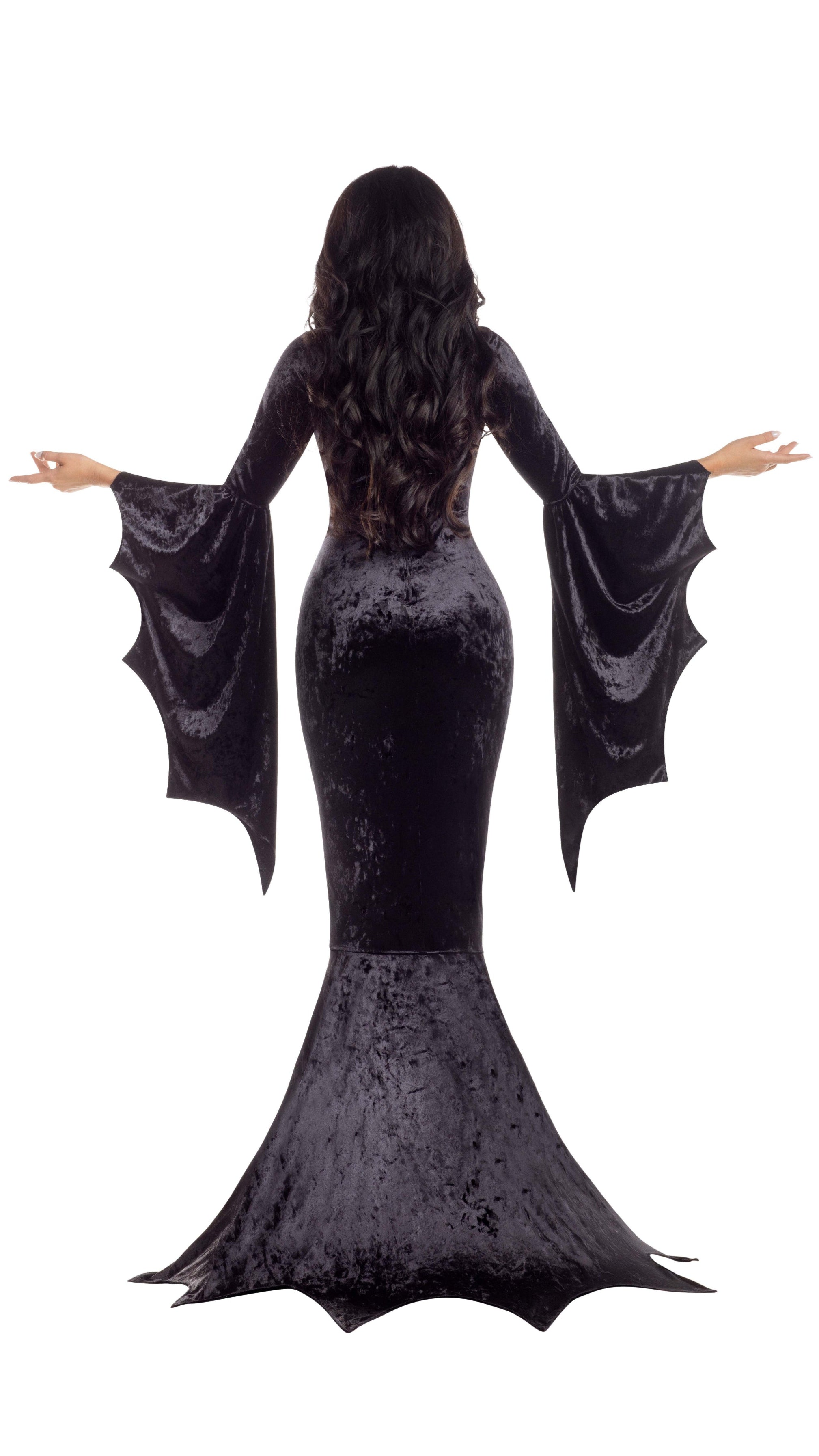 Close-up of a woman's hand showcasing the Vamp Dress - BLACK with gothic hem and sleeve details, crafted from crushed velvet, emphasizing its elegant silhouette.