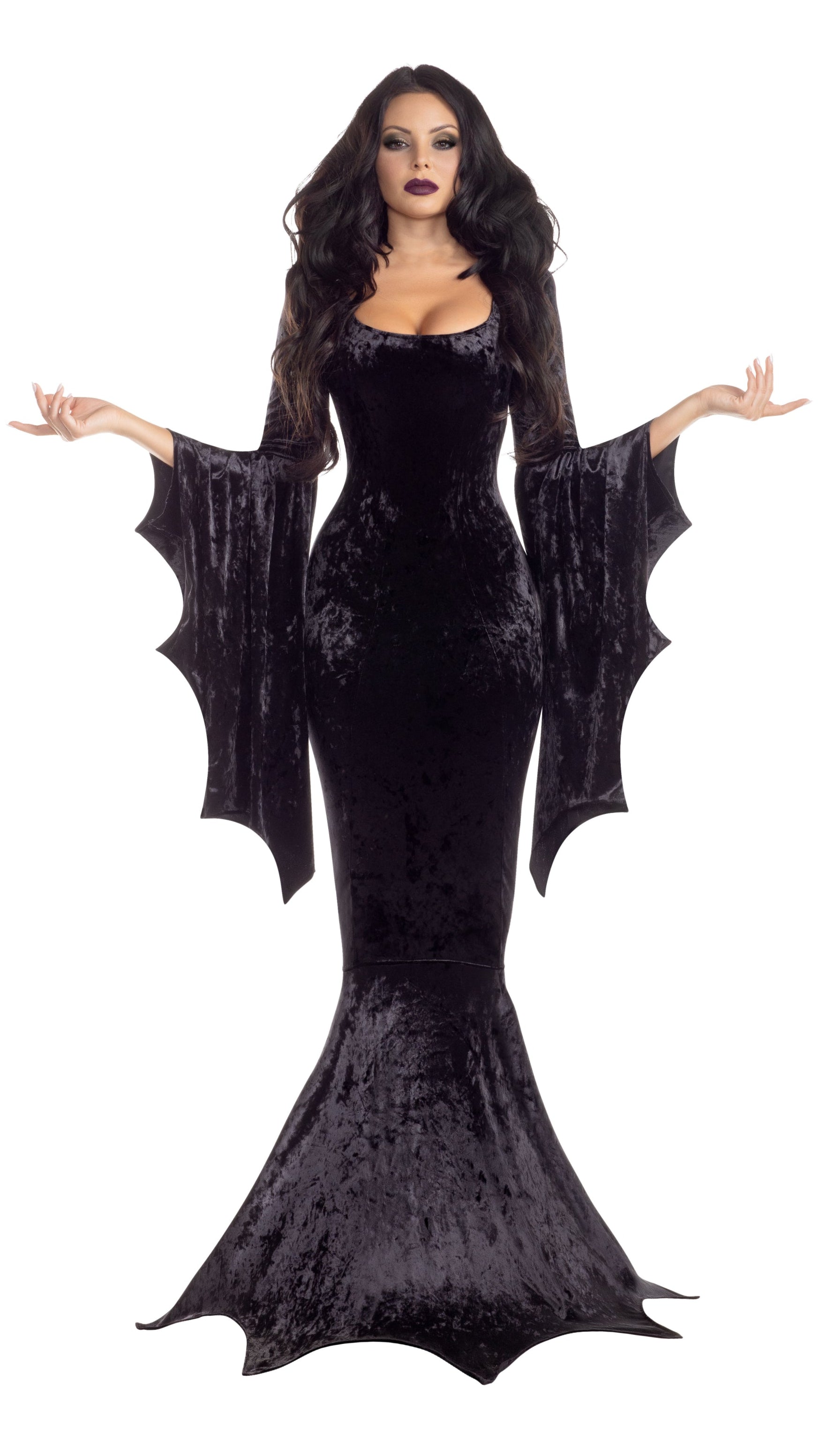 Woman wearing Vamp Dress - BLACK, featuring gothic hem and sleeve details, showcasing its crushed velvet texture.