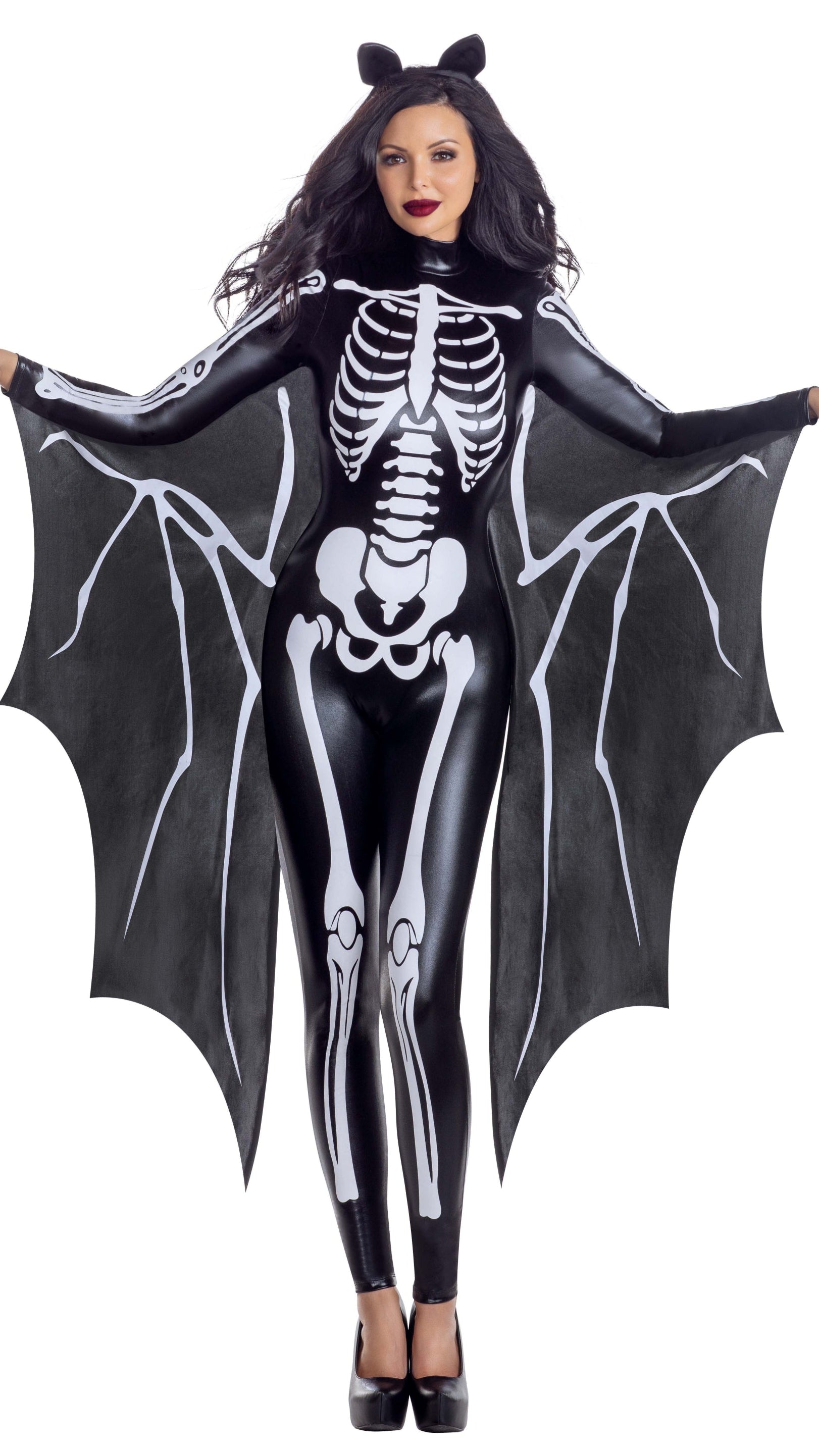 Dark Skeleton Glam Women’s Halloween Costume features a sleek lamé bodysuit with skeleton print, bat-wing cape, and cat-ear headband, creating a perfect gothic glam look for Halloween events.