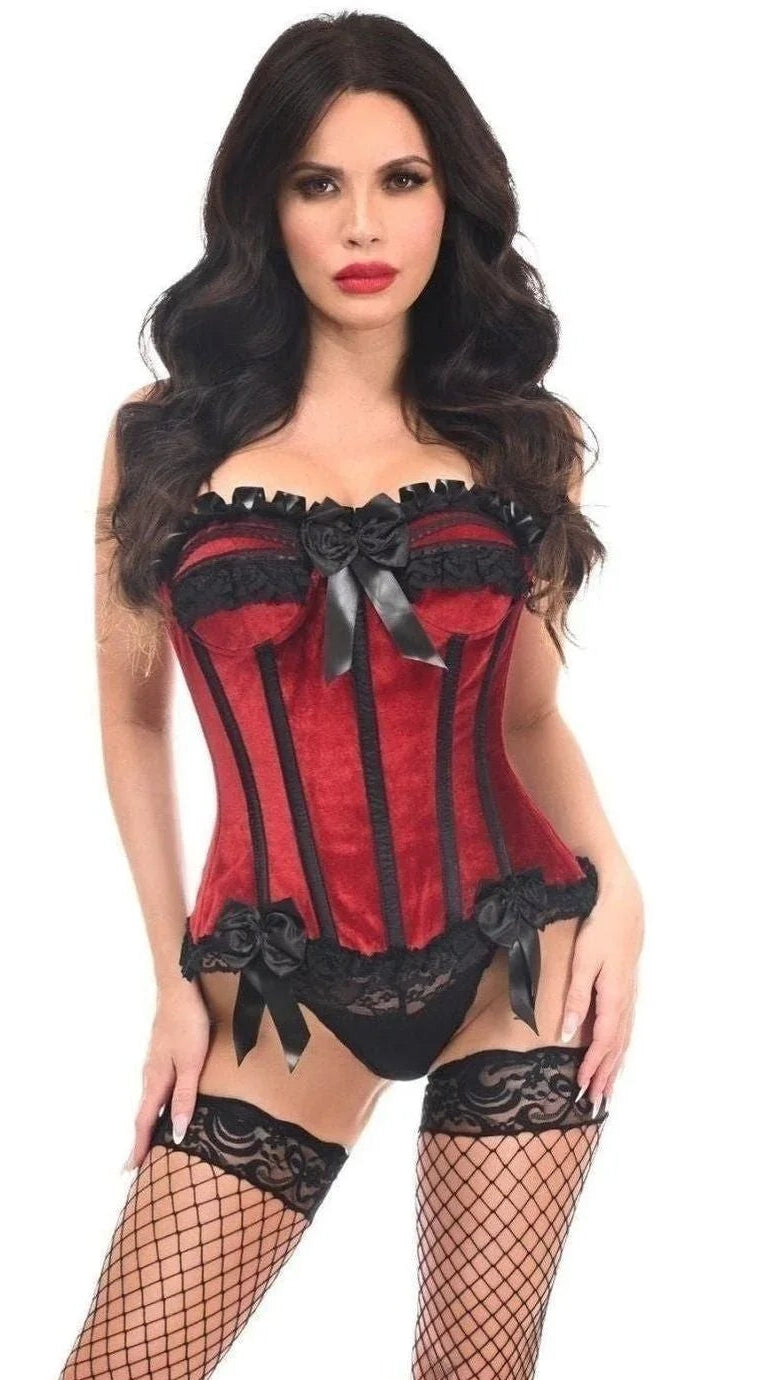 The woman models the Top Drawer Dark Red Velvet Steel Boned Burlesque Corset with lace detailing, paired with black lace panties, fishnet stockings, and high-heeled sandals, showcasing its elegant design and structure.