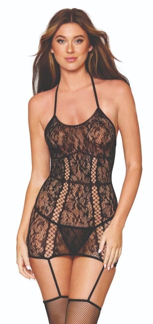 Woman modeling Crisscross Strap Lace Garter Dress with crisscross lines, lace detailing, and attached fishnet stockings, featuring adjustable halter ties. G-string not included.