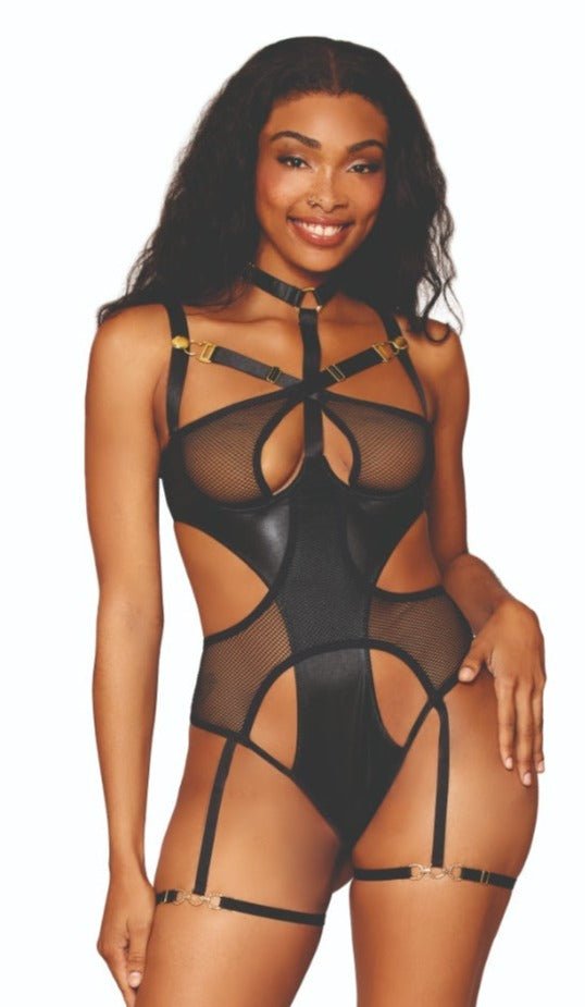 Woman wearing Exotic Faux-Leather and Fishnet Garter Teddy with crisscross neckline, adjustable straps, gold connectors, and attached harness, showcasing a bold fashion statement.