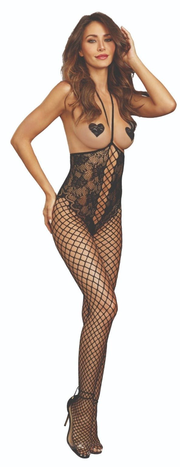 Woman modeling Open Bust Sensual Lace Teddy Bodystocking featuring fishnet tights and open-cup design, highlighting its provocative style with adjustable halter and open-crotch.