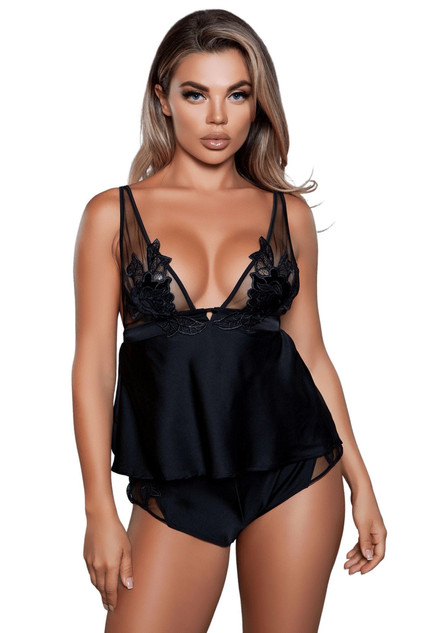 Woman modeling the Floral Embroidered Cami Set, featuring a satin top with sheer mesh and lace details, paired with elasticated mini shorts.