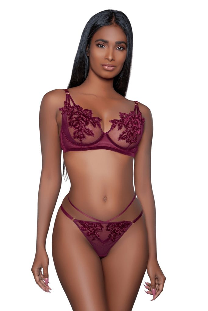 Lace Floral Lingerie Set featuring a sheer mesh bra with floral appliqué and matching multiple-strap thong, modeled by a woman with long black hair.