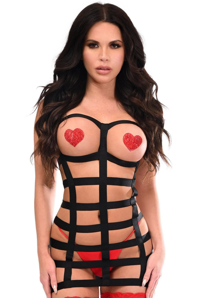 Woman modeling Noir Stretch Cage Harness with Silver Accents, featuring black elastic design. Red heart pasties are visible, showcasing the harness's stylish appearance.