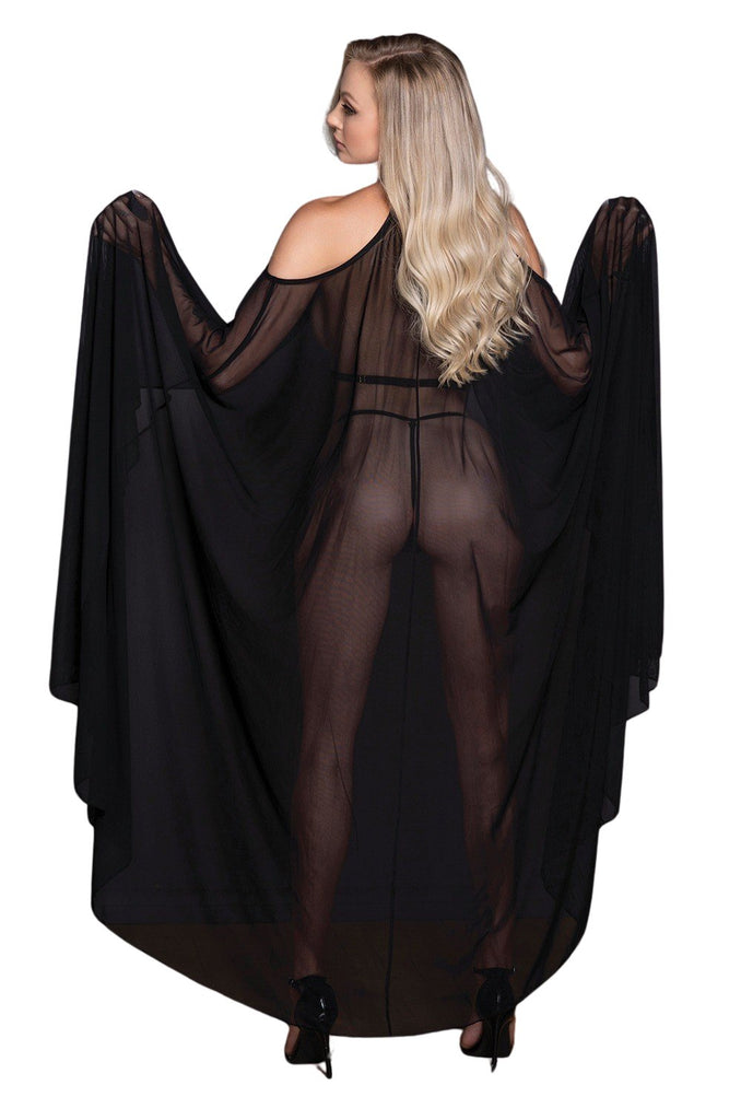 Woman wearing an Open Shoulder Sheer Maxi Cape, showcasing its sheer mesh design and adjustable criss-cross straps, complemented by an open front G-string.