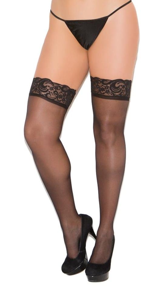 Plus Size Sheer Lace Top Thigh Highs modeled by a woman in black lingerie, showcasing intricate lace design and elegant fit on thighs.