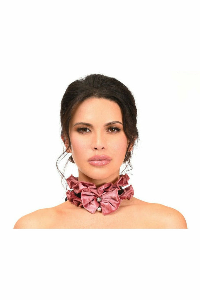 Woman wearing the Sexy Dusty Rose Velvet Costume Choker with a pink bow, rhinestone, and bell embellishments, highlighting its elegant design.