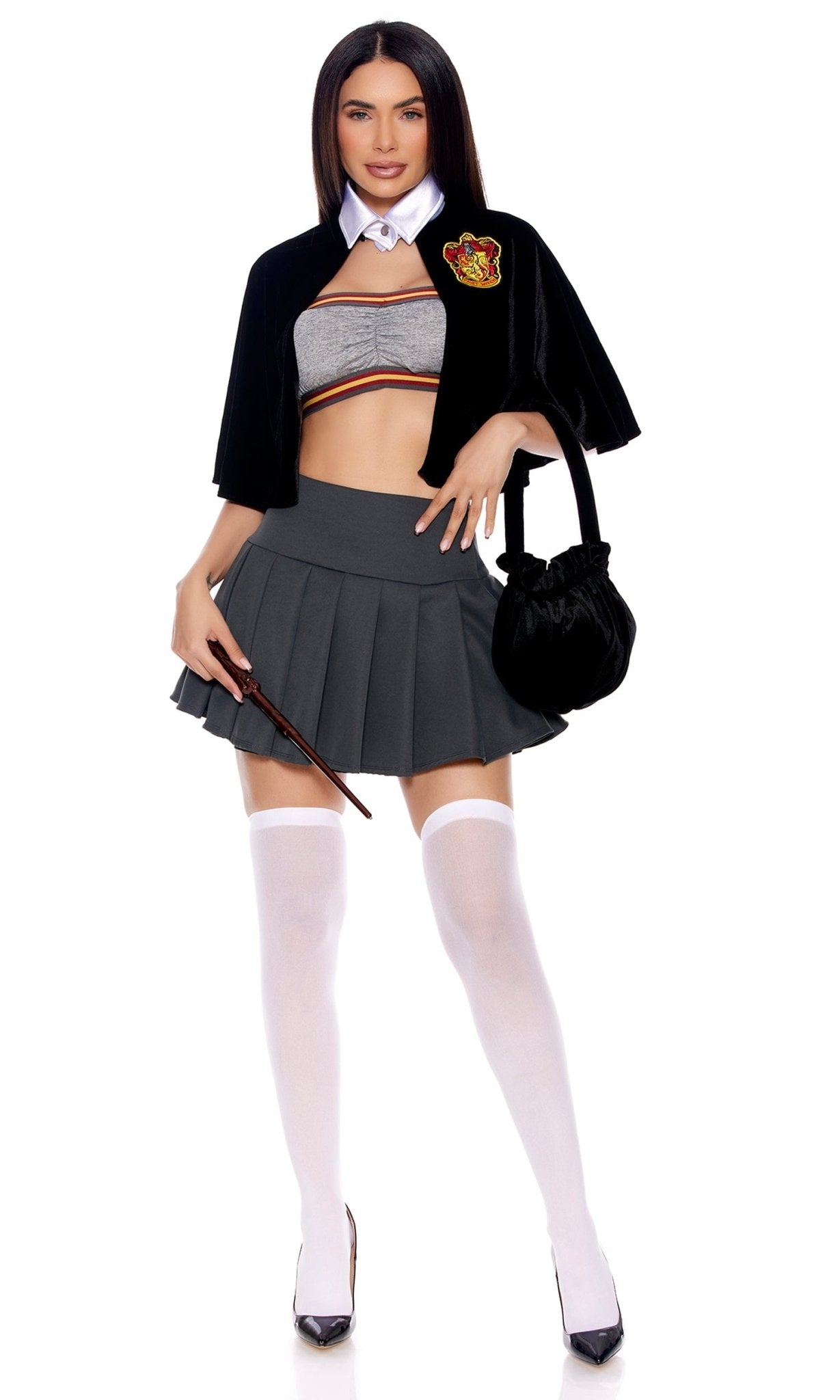Woman modeling the Sexy Hermione Witch Halloween Costume, featuring a bandeau crop top, pleated mini skirt, velvet cape, and cauldron-shaped bag.