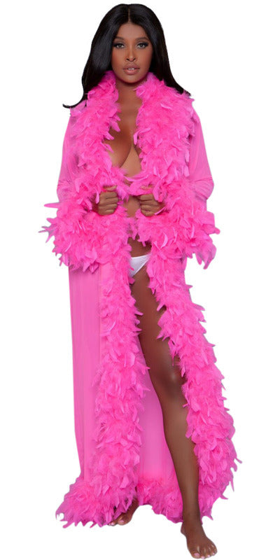 Woman wearing the Sexy Long Boa Feather Glamour Robe in Hot Pink, featuring a sheer design with luxurious chandelle feather trim.