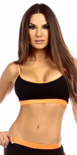 Woman modeling the Sexy Neon Trim Fit Principle Athletic Crop Sports Bra Top, featuring a snug fit and scoop-neck design, ideal for workouts.