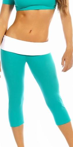 Woman wearing Sexy Roll Down Sport Band Stretch To Fit Shred Capri Yoga Leggings, showcasing comfort and style in teal and white.