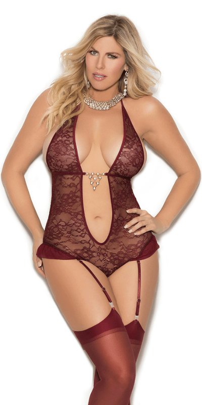 Woman in Plus Size Wine Ultra Plunge Lace Halterneck Teddy with deep V plunge, rhinestone detail, and detachable garters, modeling the lingerie.