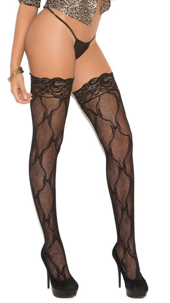 Woman wearing Stay Up Lace Thigh Highs with Back Seam, showcasing black stockings with a back seam detail, complemented by gold shirt and accessories.